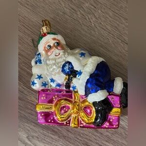 Vintage Radko Presently Resting Santa Ornament 4.5” 2001 On A Pink Purple Gift